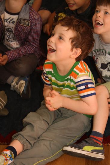 enrapt audience at a Mr Banana Head kids magic show