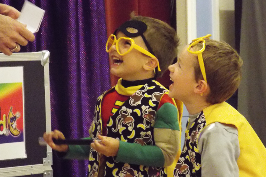 kids laughing at mr banana head magic show